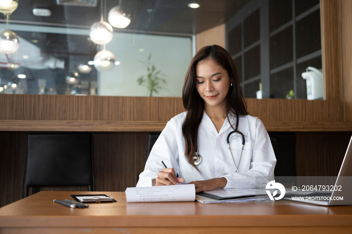 Smiling female doctor working in medical clinic.