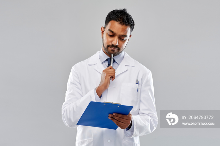 medicine, science and profession concept - indian male doctor or scientist in white coat with clipbo