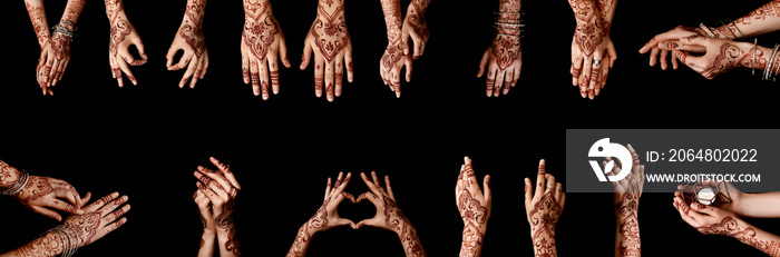 Beautiful female hands with henna tattoo on dark background