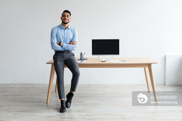 Arab Worker Showing Laptop With Black Empty Screen, Mockup