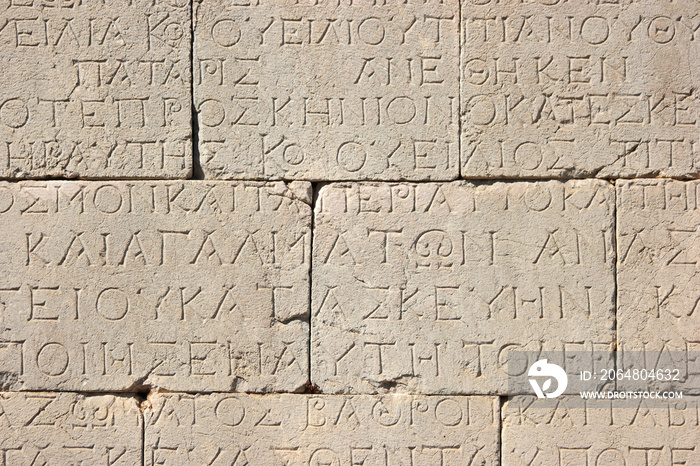 Old Medieval inscription carved on stone.