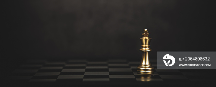 Close-up king chess standing on chess board concept of team player or business team and leadership s