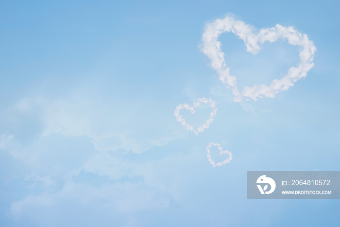 Heart shaped cloud in blue sky. Valentine and wedding background