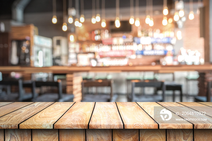 Empty wood top table with space for display product in Blurred cafe background.