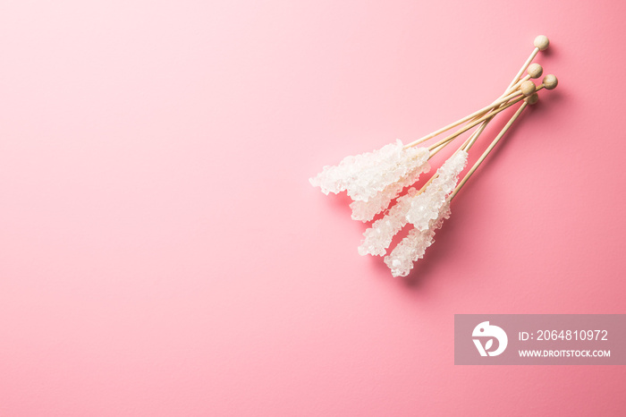 Crystallized sugar on wooden stick.