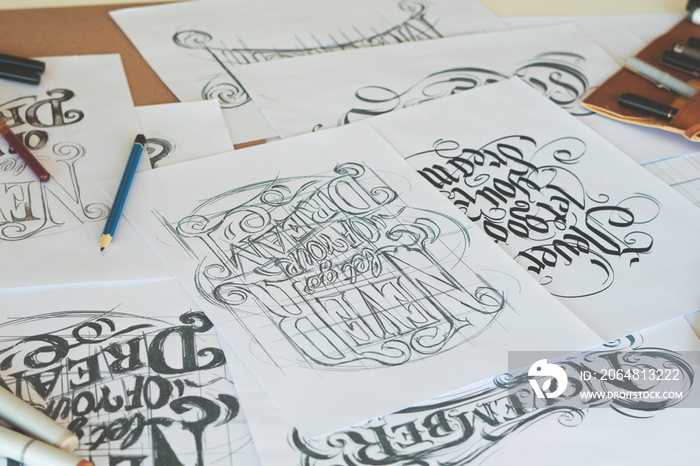 Typography Calligraphy artist designer drawing sketch writes letting spelled pen brush ink paper tab