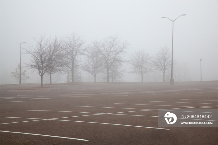 Empty parking lot on a foggy winter day