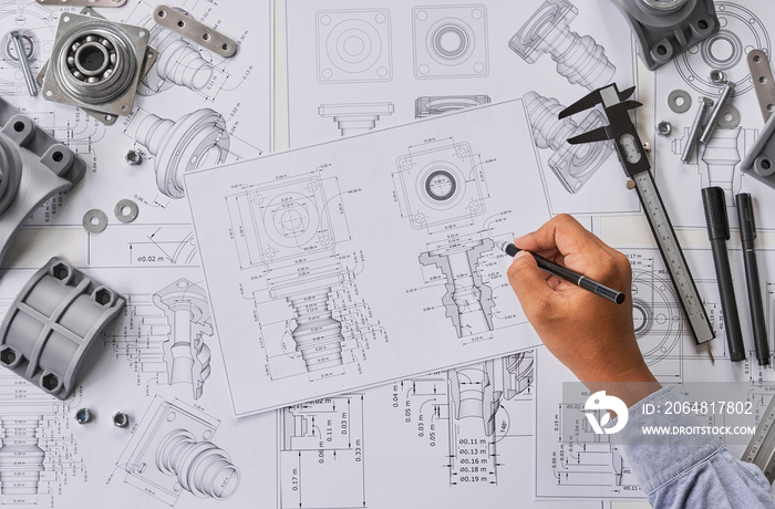 Engineer technician designing drawings mechanical parts engineering Engine.manufacturing factory Ind