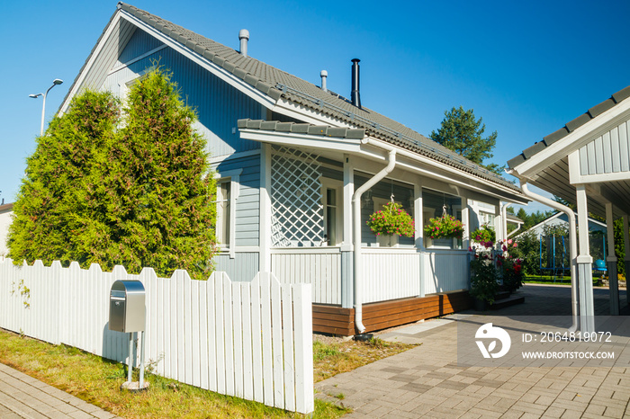 Traditional wooden house decorated with flowers in Finland