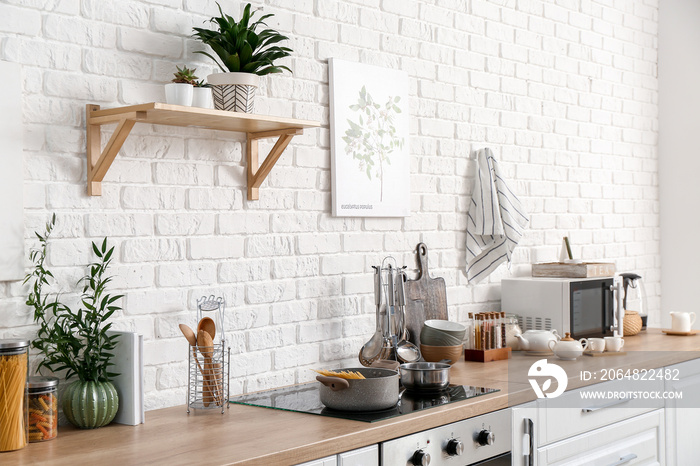 Set of utensils and products on kitchen counter