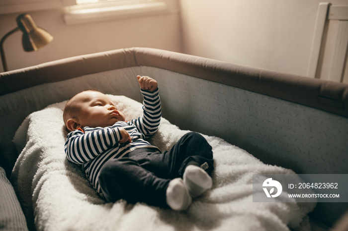 Close up of a baby sleeping in his crib