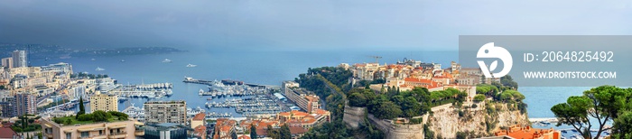 Panoramic view of Monaco coast at sunset in overcast day