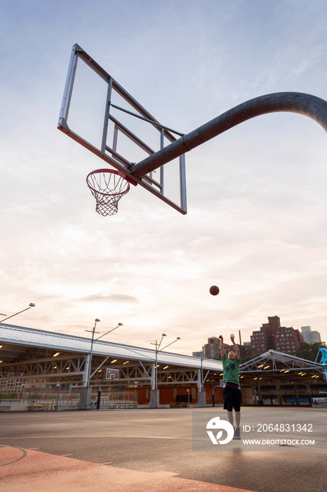 Young man playing basketball