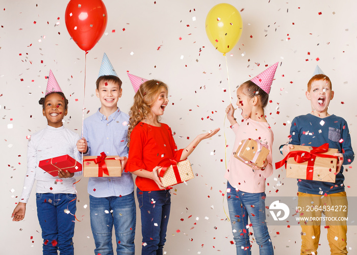 Happy kids celebrating birthday party over background