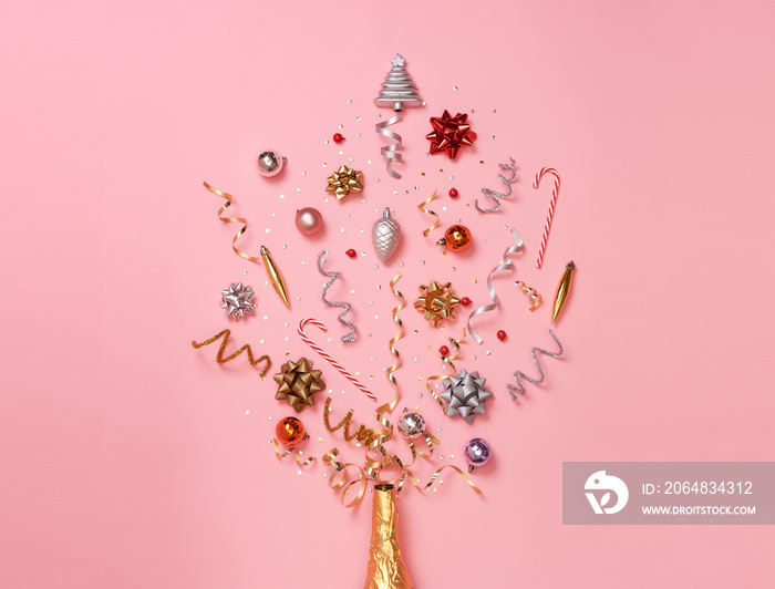 Christmas composition with decorations and ribbon with star confetti on pink pastel background. wint