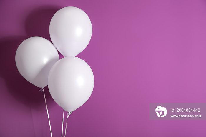 Balloons on color background