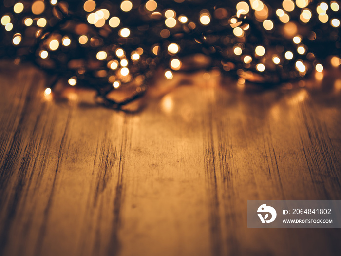 christmas fairy lights on a wooden table,studio shot.