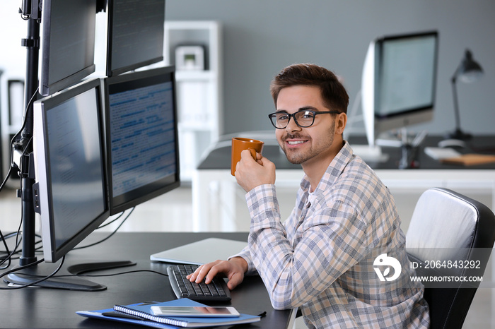 Male programmer working in office