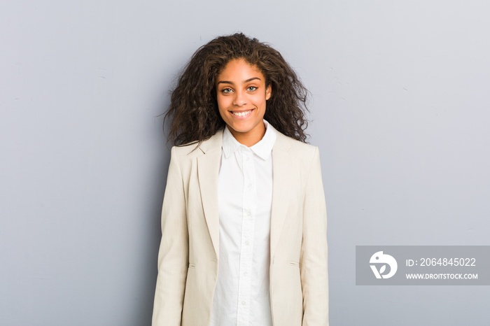 Young african american business woman happy, smiling and cheerful.