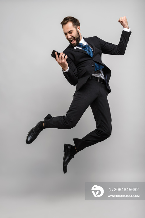 Full length of an attractive smiling young businessman