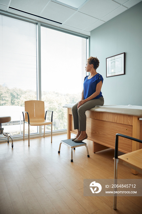 Woman waiting in examination room