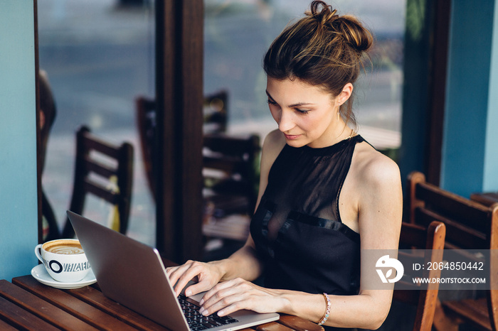 Attractive business woman working at his laptop