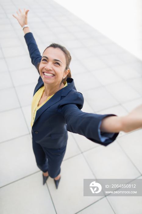 Portrait exuberant businesswoman celebrating