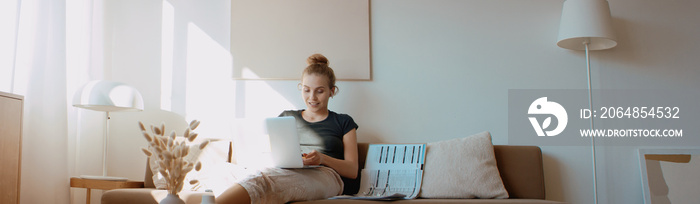 Caucasian female working from home, having a video work call, making notes. Stay home, quarantine re