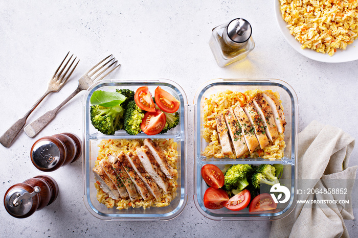 Healthy meal prep containers with chicken, rice and vegetables