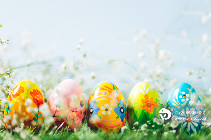 Decorative eggs on green grass.