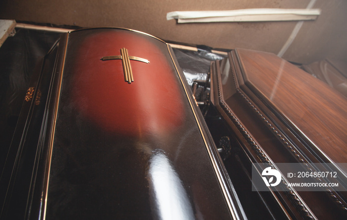 Wooden coffins in the dark room.