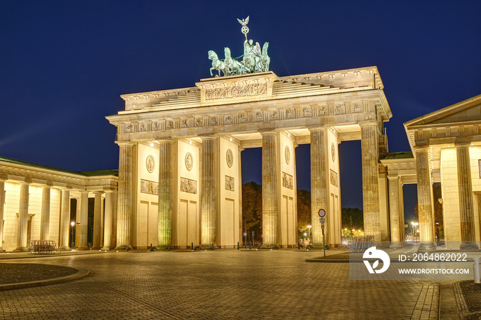 The famous Brandenburg Gate in Berlin illuminated at night