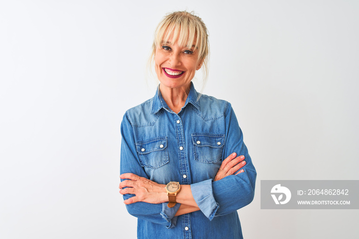 Middle age woman wearing casual denim shirt standing over isolated white background happy face smili