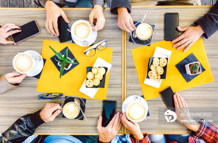 Top view of hands drinking at coffee shop restaurant - People having breakfast together with mobile 