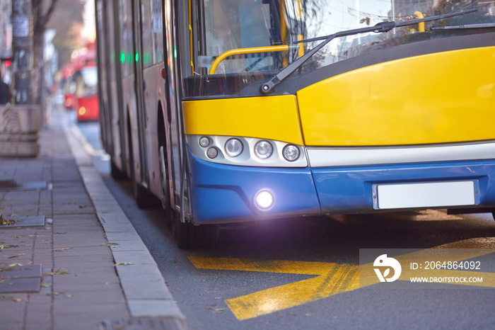 Public transportation / bus in urban surroundings on the street.