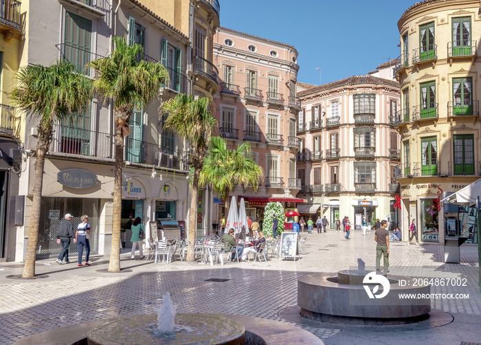 MALAGA - JUNE 12: City street view with cafeteria terraces and s