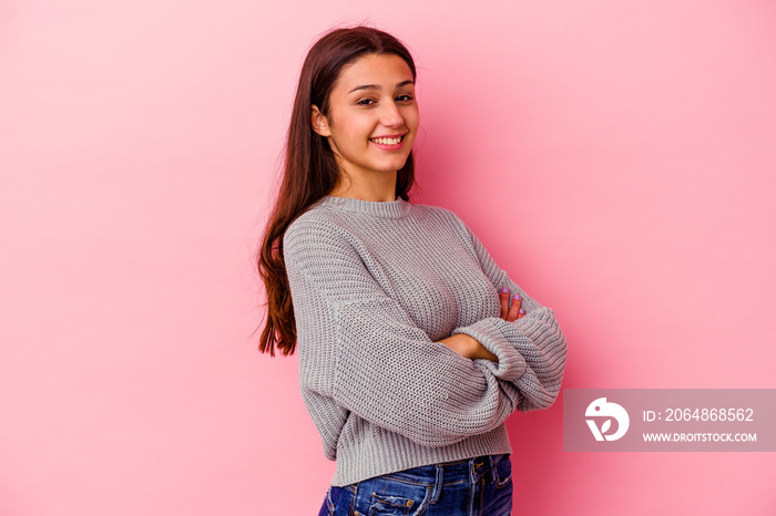 Young Indian woman isolated on pink background happy, smiling and cheerful.