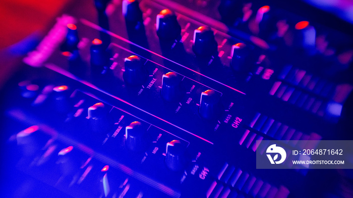 Mixing console. Neon illumination around