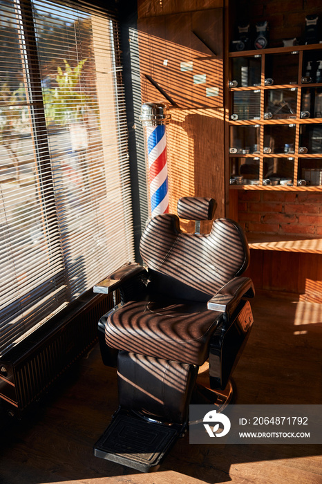 Interior of barbershop with professional barber chair