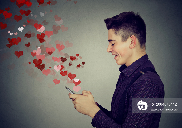 man sending love messages on mobile phone hearts flying away