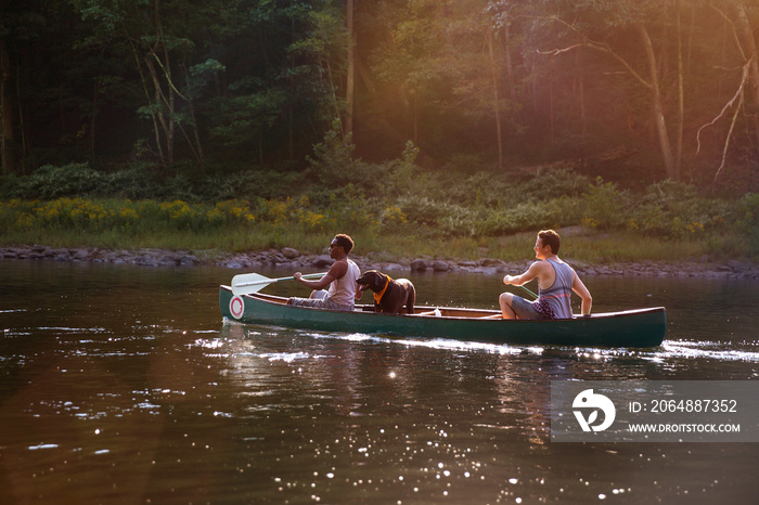 Friends canoeing in river