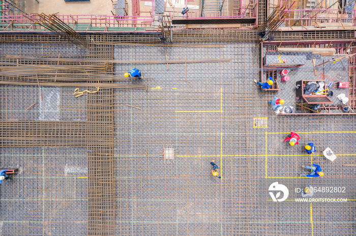 Aerial view of group of construction worker building in construction site.