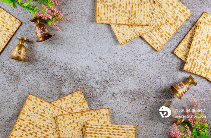 Four wine cups with matzah. Jewish holidays Passover concept.