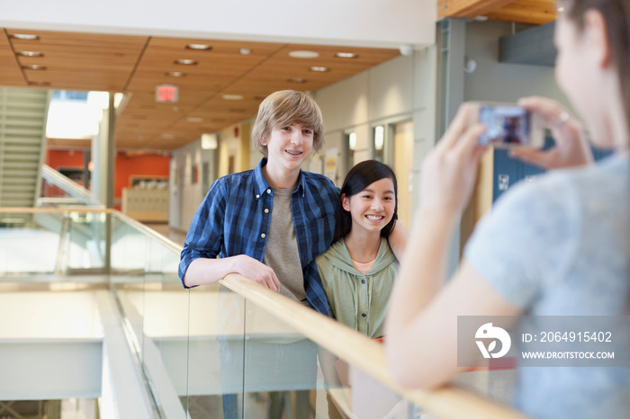 middle school students taking pictures of each other