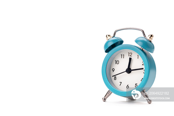 old blue alarm clock isolated on a white background. copy space. studio shot. time symbol. schedule 