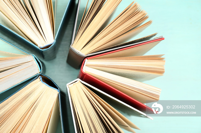 Group of books on colorful background, top view