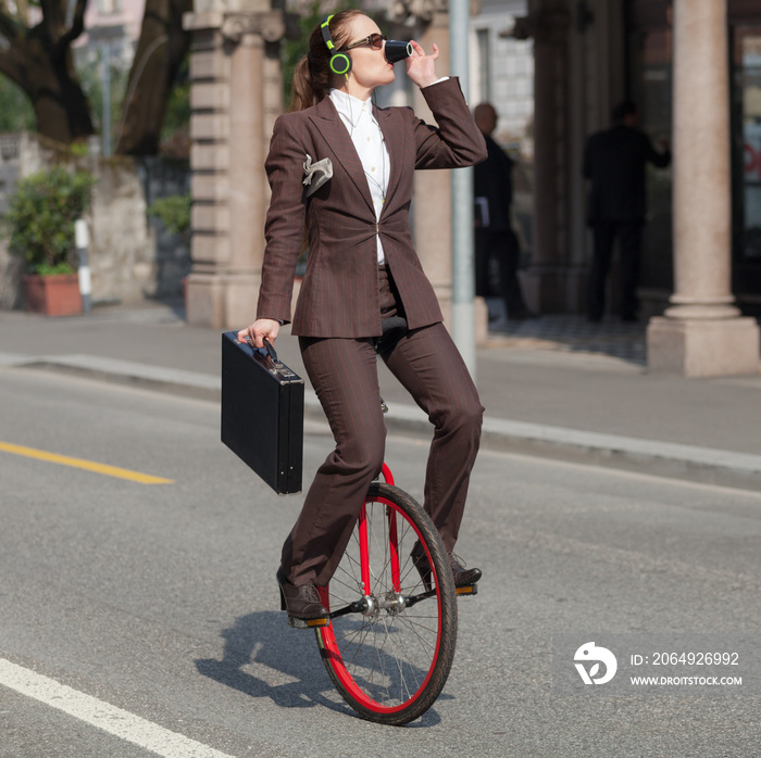 businesswoman with unicycle