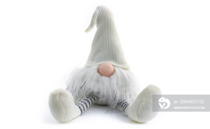 Gnome a Christmas elf is relaxed and sitting on white background with open legs