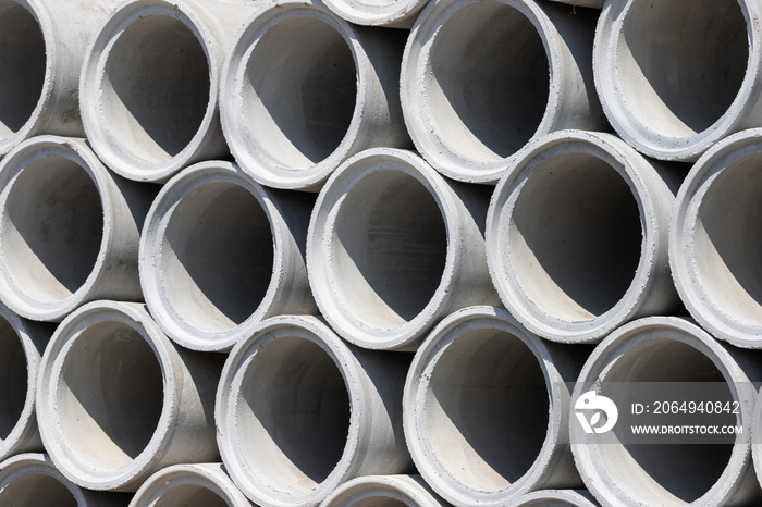 Concrete drainage pipes with light and shadow at noon time.