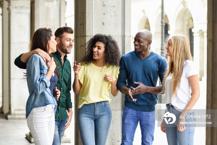 Multi-ethnic group of friends having fun together in urban background